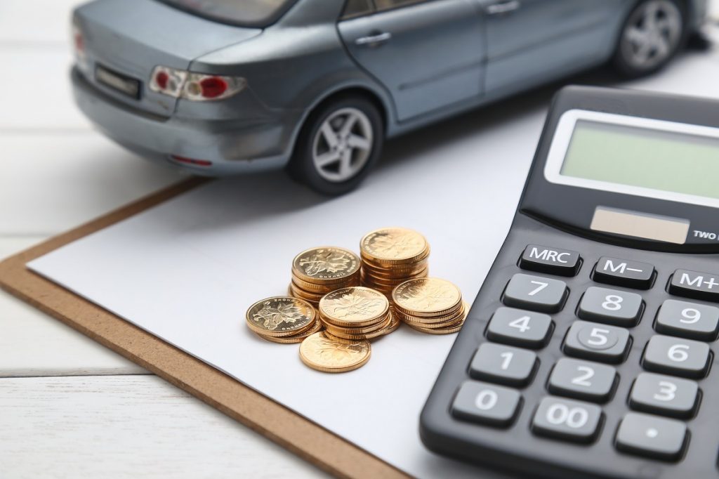 car model calculator coins white table - Bizmedia.kz